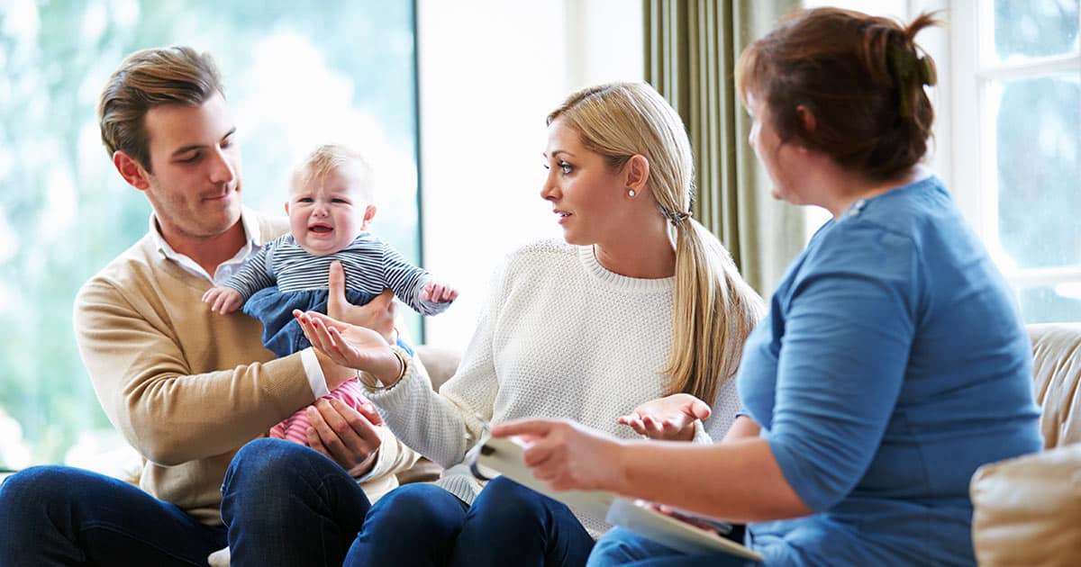 Social worker helping a young family